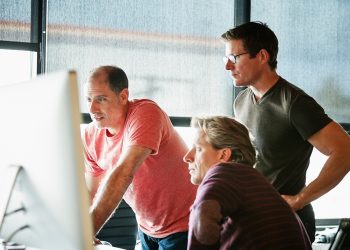 work team looking at computer