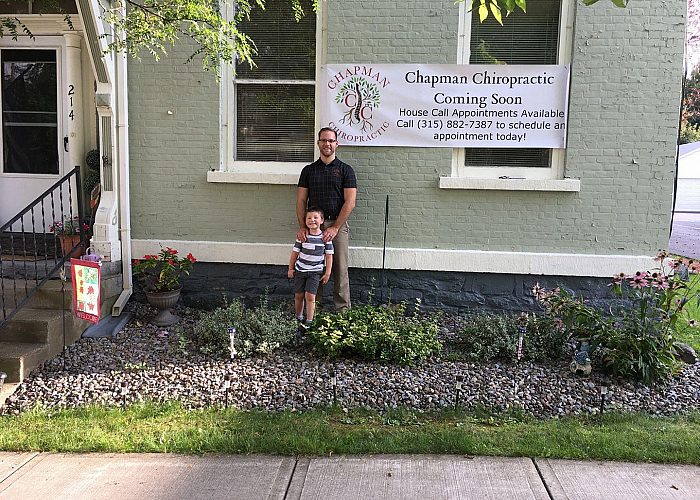 Father and Son Outside of a Chiropractic Practice