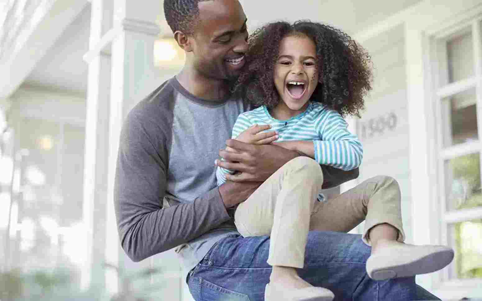 Dad and daughter laughing