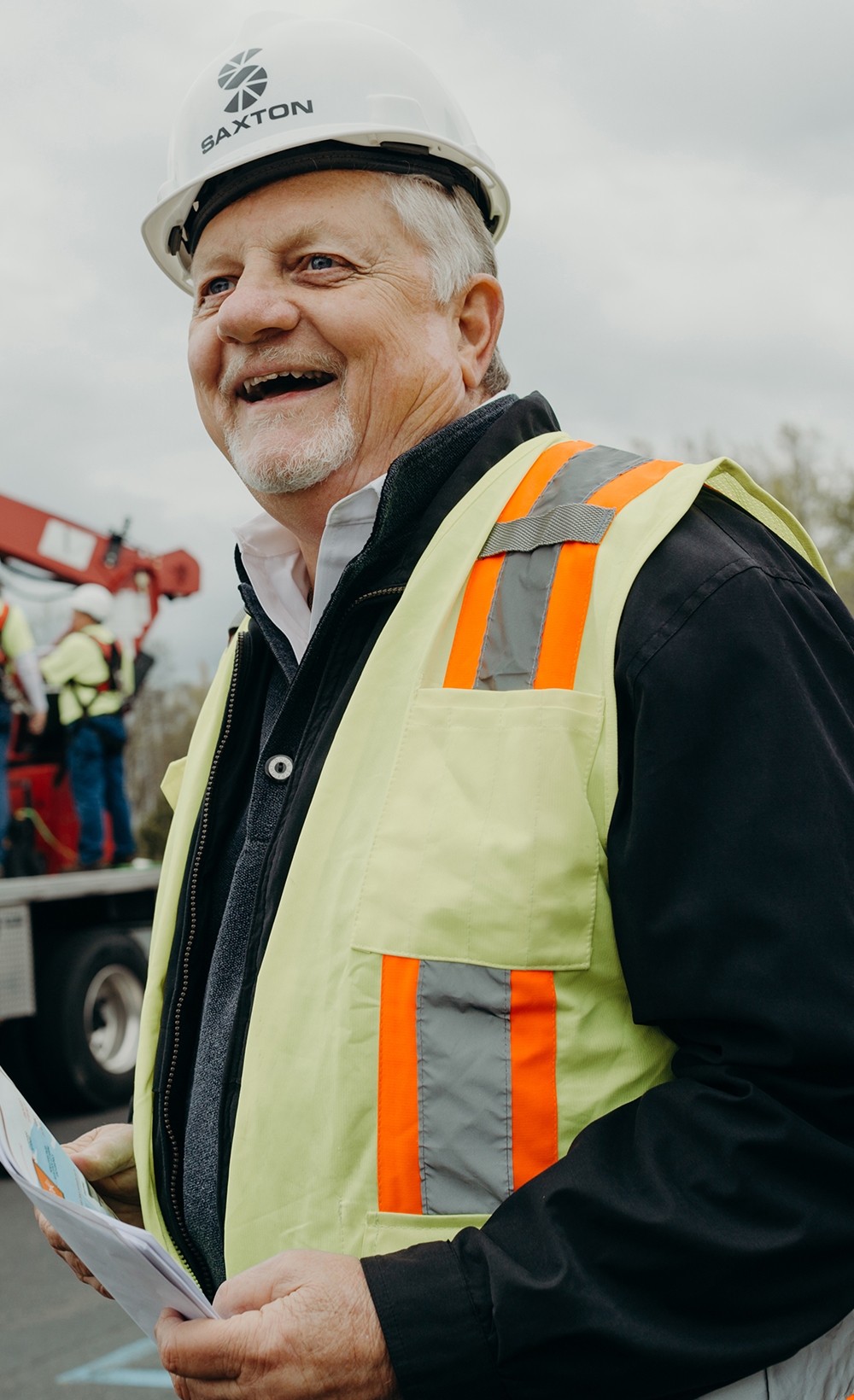 Man wearing hard hat and yellow vest