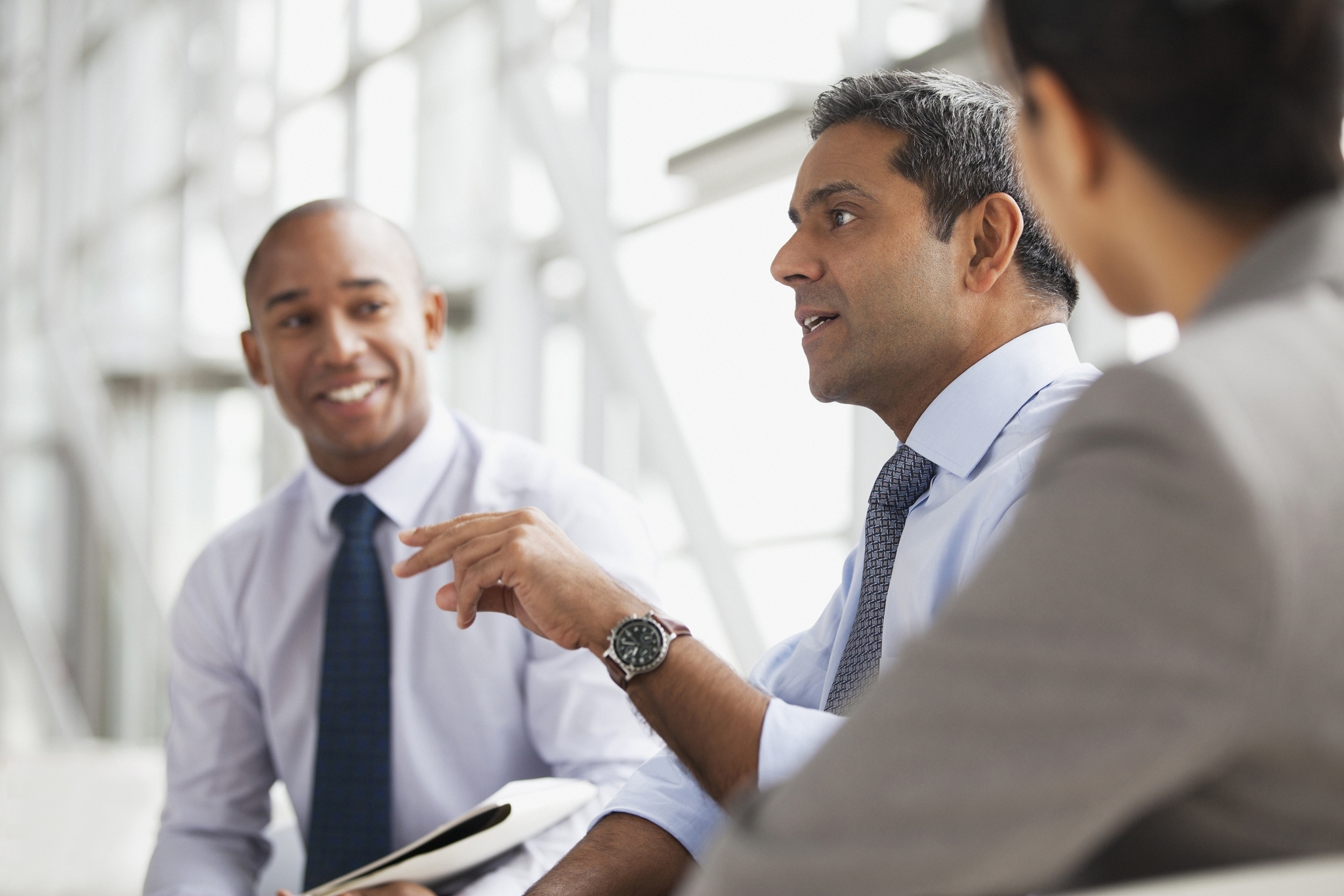 Three Men in Suits Talking