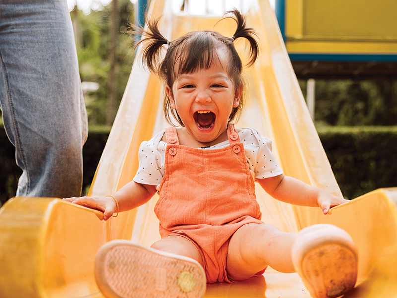 Little girl slide playground