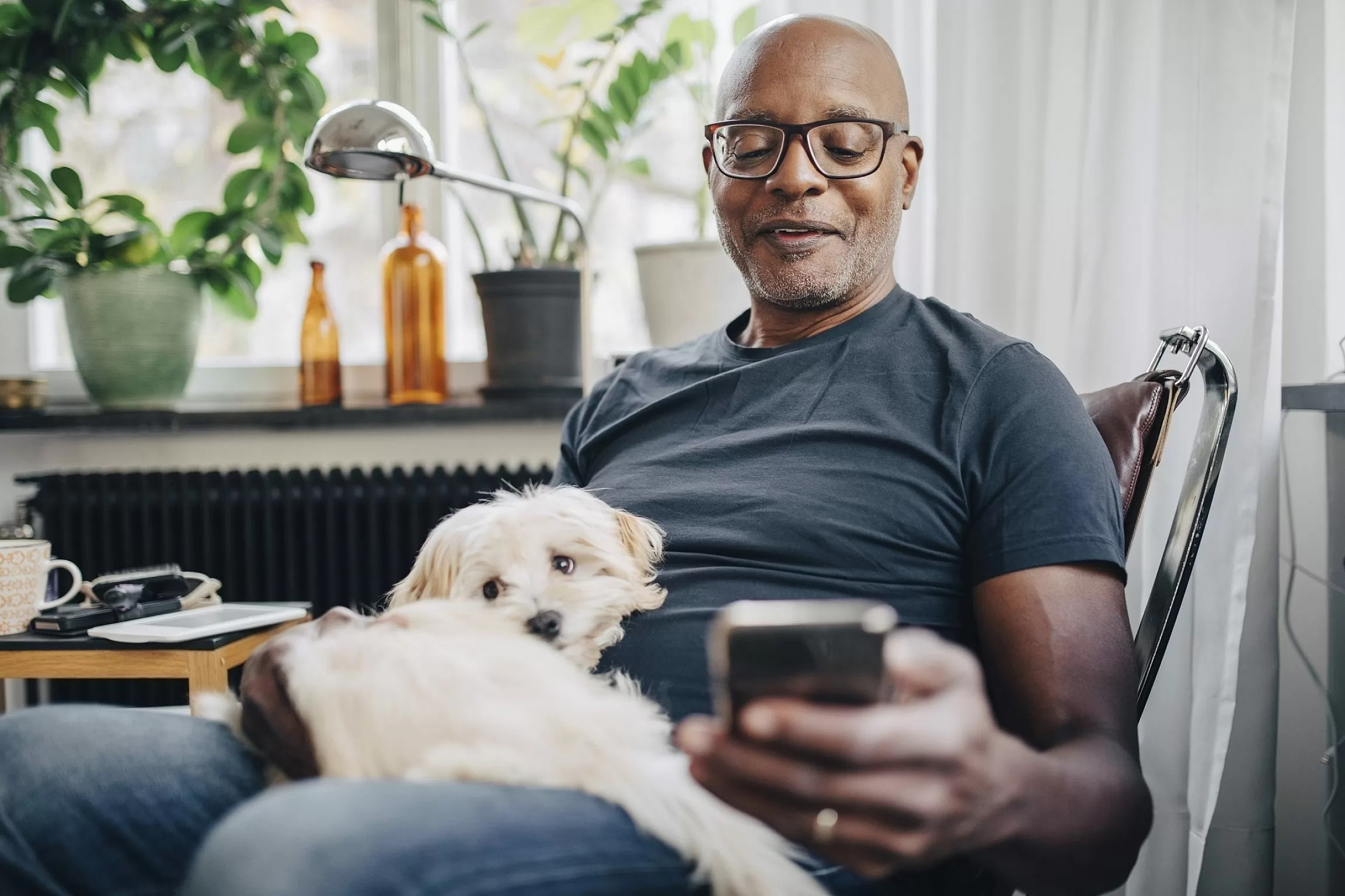 Man with dog on phone